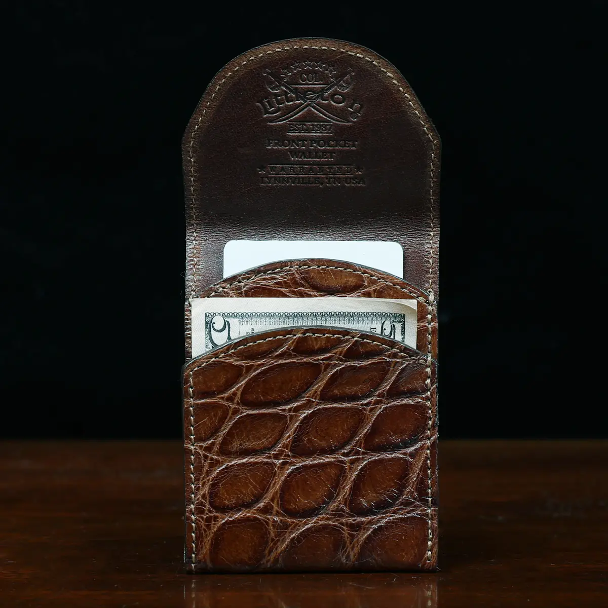 View larger image of Alligator - front open view - 001 - on wood table with a dark background