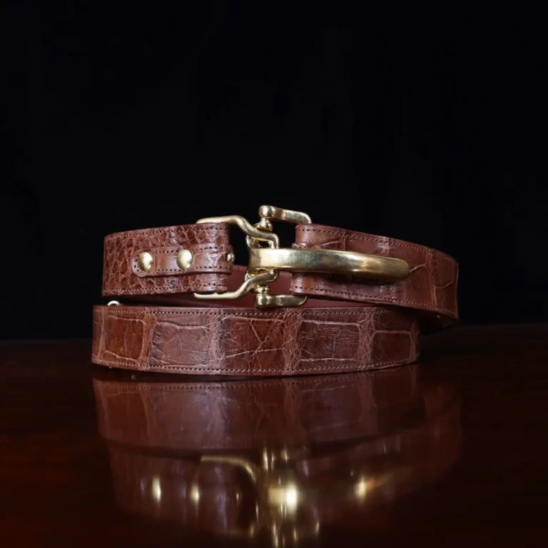 No. 5 Cinch Belt in brown American Alligator and brass buckle - ID 002 - front coiled view on black background