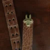 no 5 cinch belt in american alligator - size small- hook view on a wood table and dark background - id 002
