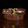 No. 5 Cinch Belt in brown American Alligator and brass buckle - ID 001 - front coiled view on black background