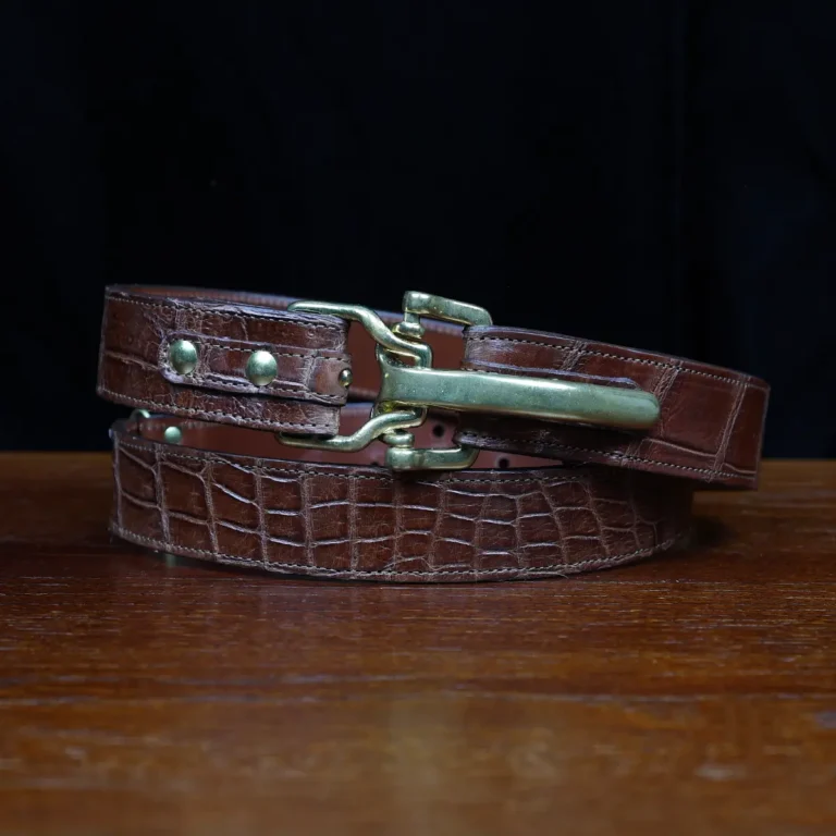 No. 5 Cinch Belt in Vintage Brown American Alligator with Brass hardware - X-Large - ID 001 - coiled front view cut out onNo. 2 Card Wallet in Vintage Brown American Alligator - ID 001 - front coiled view on a black background