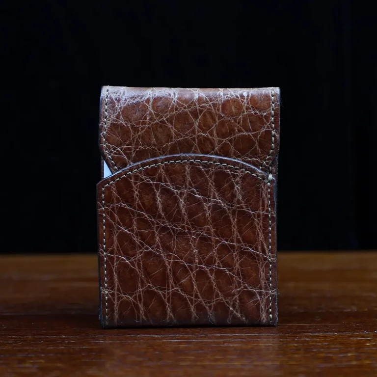 Front pocket wallet with flap in brown American Alligator - front view - 002 - on wood table with a dark background