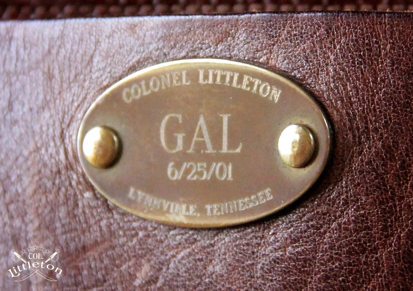 Close up of the engraved plate of Col.'s Saddlebag briefcase dated 6/25/01