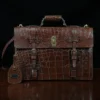 No. 1943 Navigator Briefcase in Vintage Brown American Alligator - Serial number 013 - front view with luggage tag