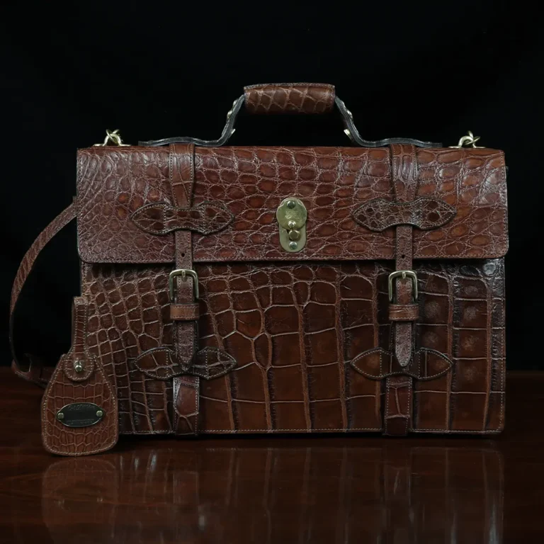 No. 1943 Navigator Briefcase in Vintage Brown American Alligator - Serial number 013 - front view with luggage tag