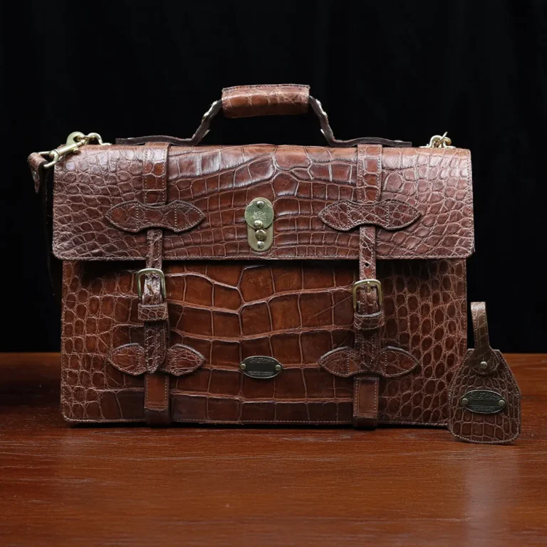 No. 1943 Navigator Briefcase in Vintage Brown American Alligator - Serial number 018 - front view with luggage tag