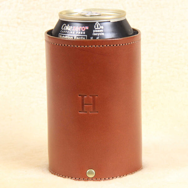 can of coke inside of brown leather can caddies