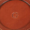 brown round leather coaster set with letter personalization