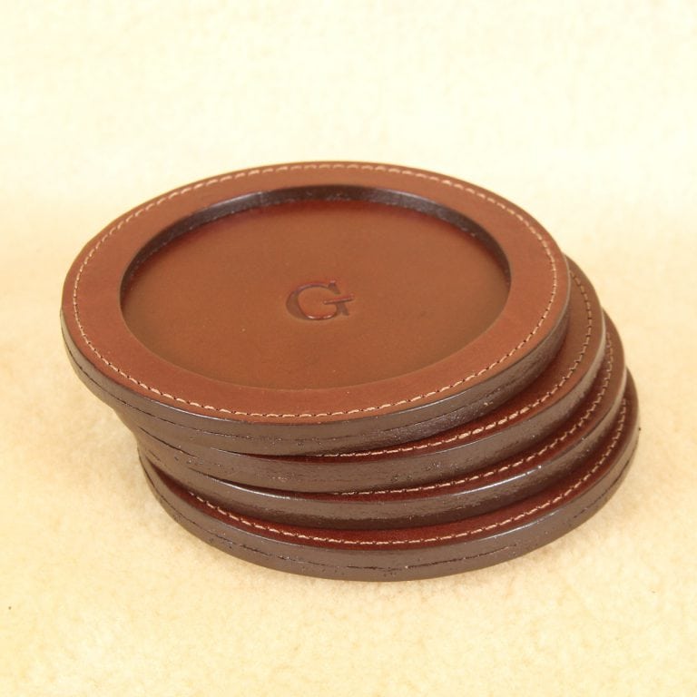 brown round leather coaster set with letter personalization