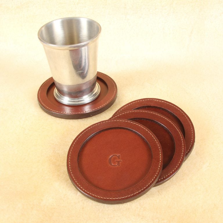 brown round leather coaster set with letter personalization