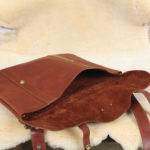 leather document bag with strap on fur