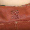 no25 drifter brown leather handbag with colonel littleton logo deboss