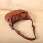 no25 drifter brown leather handbag with zippered closure and strap