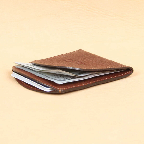 Brown leather front pocket wallet top with 3 cards and 2 bills inside pockets.