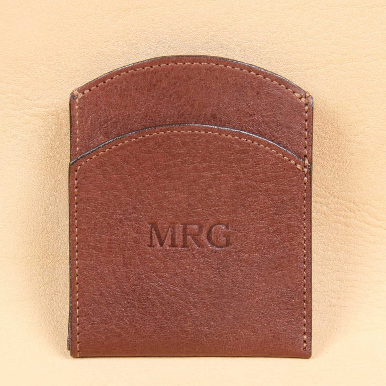 Brown leather front pocket wallet empty front with 3 embossed initials centered.