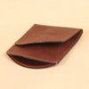 Brown leather front pocket wallet empty open at top two pockets.