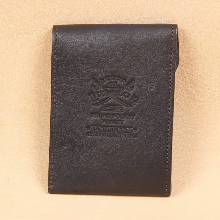 black leather front pocket wallet with fold over flap with stamp on back
