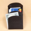 black leather front pocket wallet with fold over flap with cash and cards
