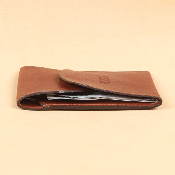 vintage brown leather front pocket wallet with fold over flap with cash