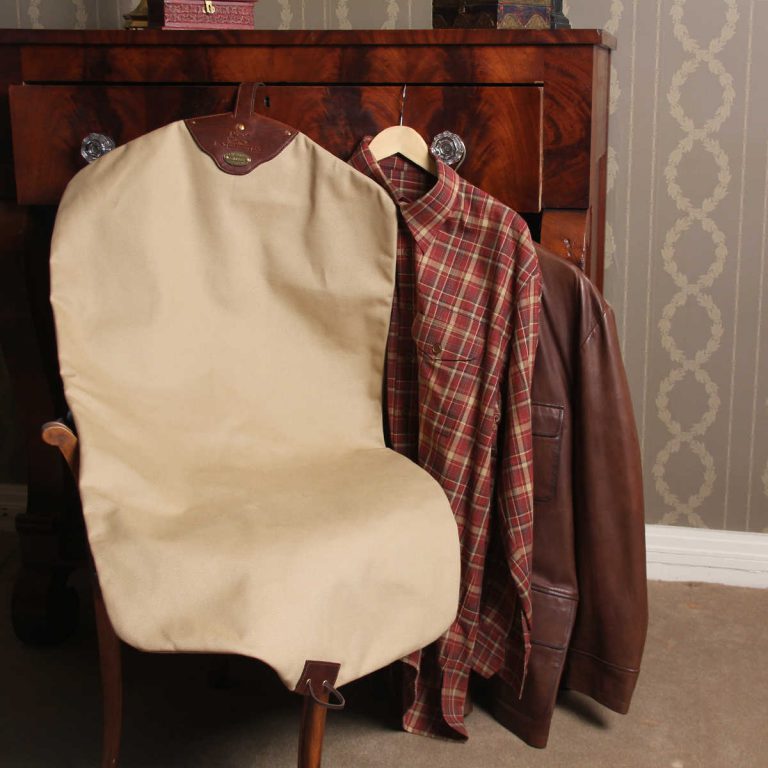 no7 khaki cotton canvas garment bag with brown leather strap and zippered closure