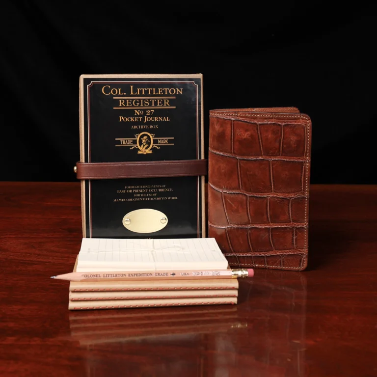 Group view of the no. 27 american alligator pocket journal with the refills, pencil, archive box and notecards included.
