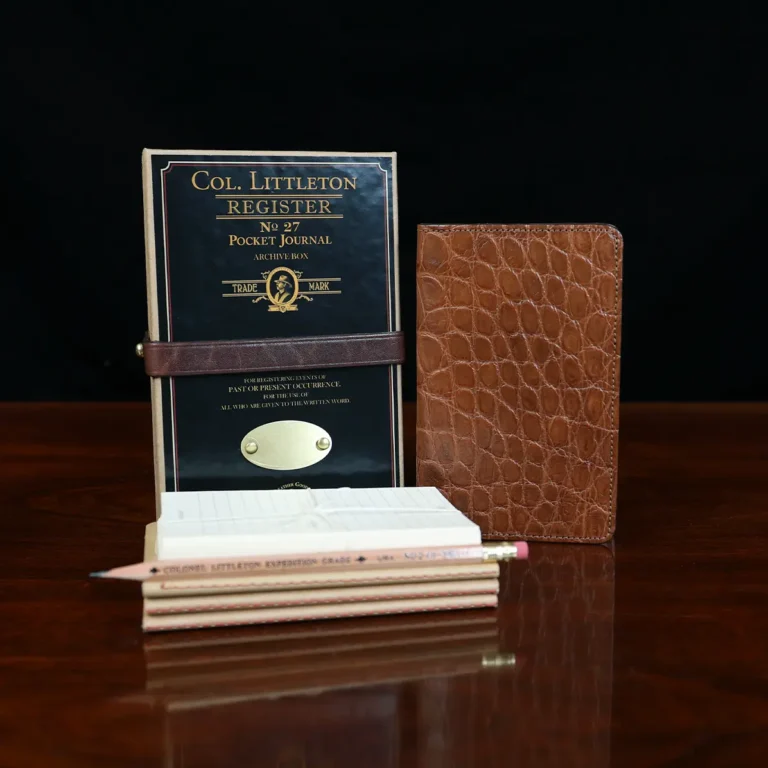 Group view of the no. 27 american alligator pocket journal with the refills, pencil, archive box and notecards included.