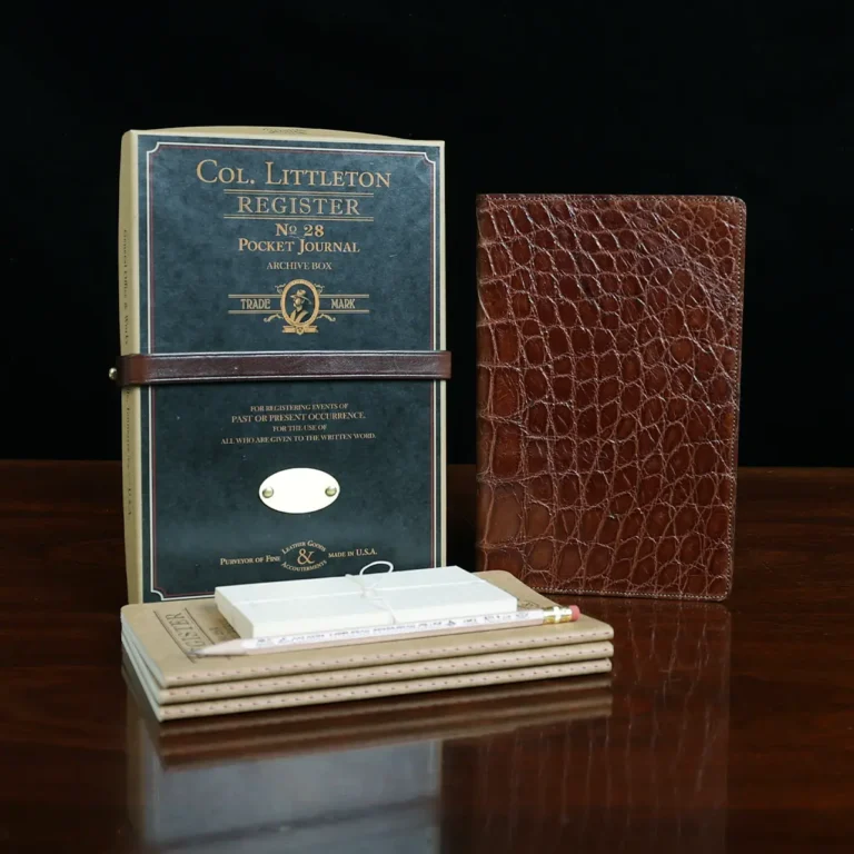 No. 28 Pocket Journal in Vintage Brown American Alligator - ID 001 - front view, shown with journal register archive box, 3 journal register notebooks, a stack of cream index notecards, and a Col. Littleton wooden No. 2 pencil - on black background