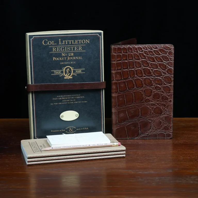 No. 28 Pocket Journal in Vintage Brown American Alligator - ID 001 - front view, shown with journal register archive box, 3 journal register notebooks, a stack of cream index notecards, and a Col. Littleton wooden No. 2 pencil - on black background