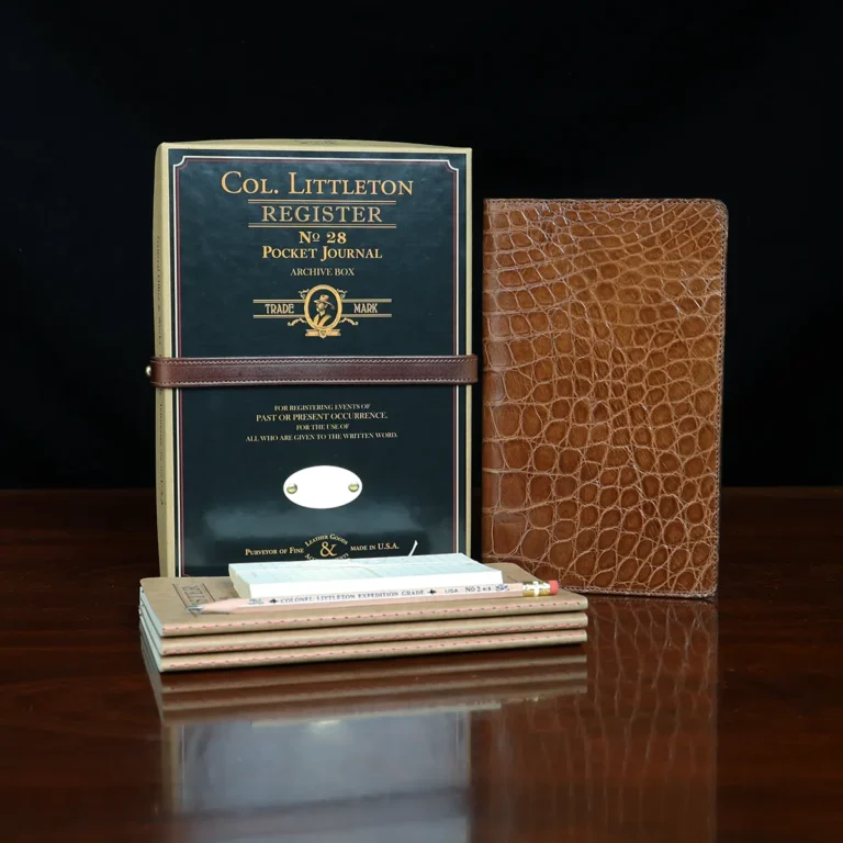 No. 28 Pocket Journal in Vintage Brown American Alligator - ID 001 - front view, shown with journal register archive box, 3 journal register notebooks, a stack of cream index notecards, and a Col. Littleton wooden No. 2 pencil - on black background