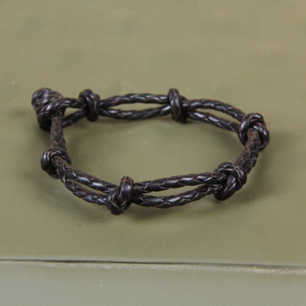 black leather mesa bracelet on green background