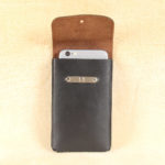 no60 black and brown large leather phone holster and phone inside