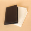 Pocket journal black leather front closed with ruled notecards.