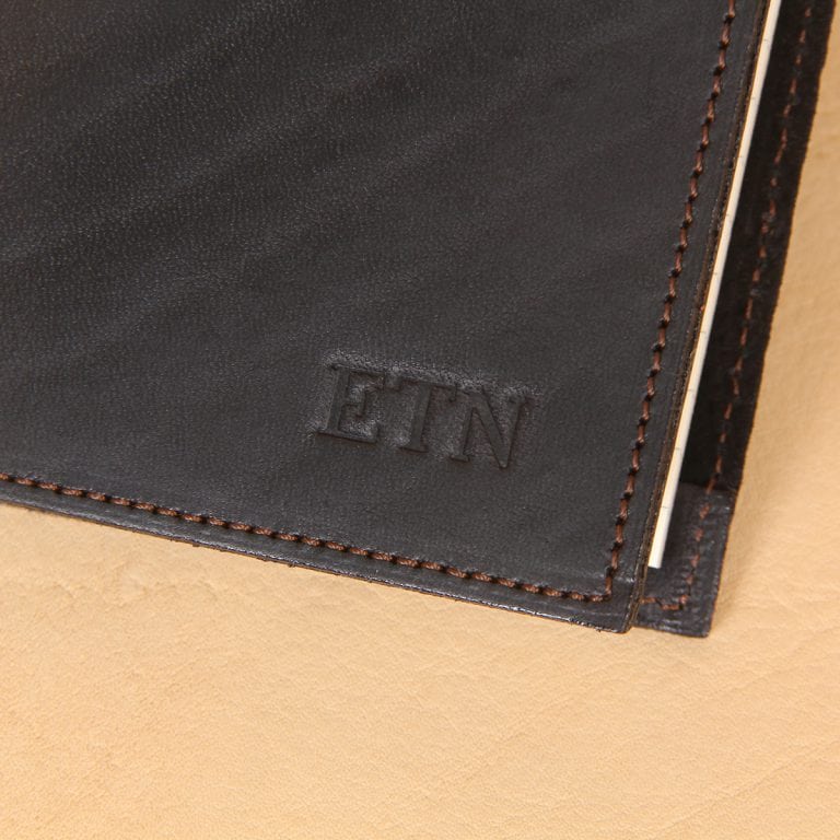 Pocket journal black leather 3 initials embossed in front, right corner.