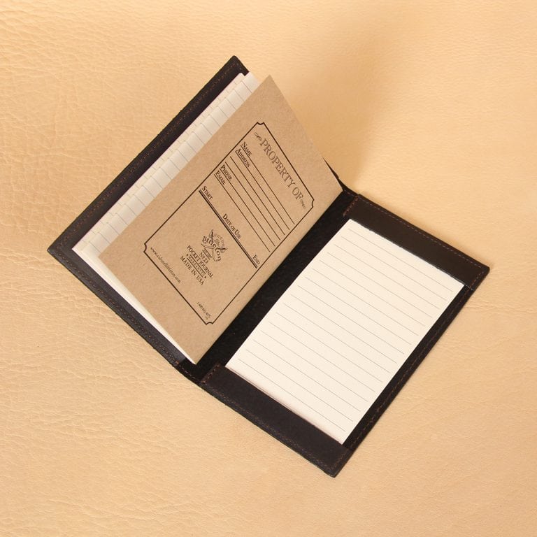Pocket journal black leather open to register notebook back and ruled notecards.
