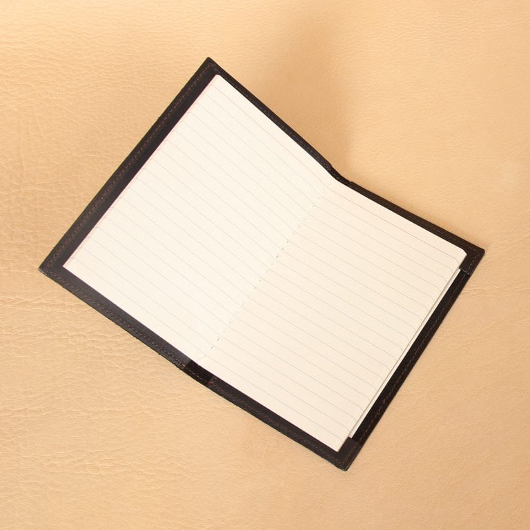 Pocket journal black leather inside ruled register pages.
