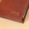 Pocket journal brown leather front 3 initials embossed in corner.