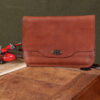 no11 vintage brown leather composition pocket on vintage wood table