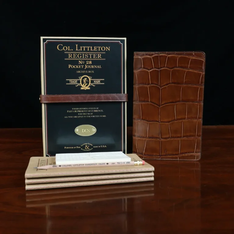 No. 28 Pocket Journal in Vintage Brown American Alligator - ID 001 - front view, shown with journal register archive box, 3 journal register notebooks, a stack of cream index notecards, and a Col. Littleton wooden No. 2 pencil - on black background