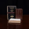 No. 27 Pocket Journal in Vintage Brown American Alligator - ID 001 - front view, shown with journal register archive box, 2 journal register notebooks, a stack of cream index notecards, and a Col. Littleton wooden No. 2 pencil