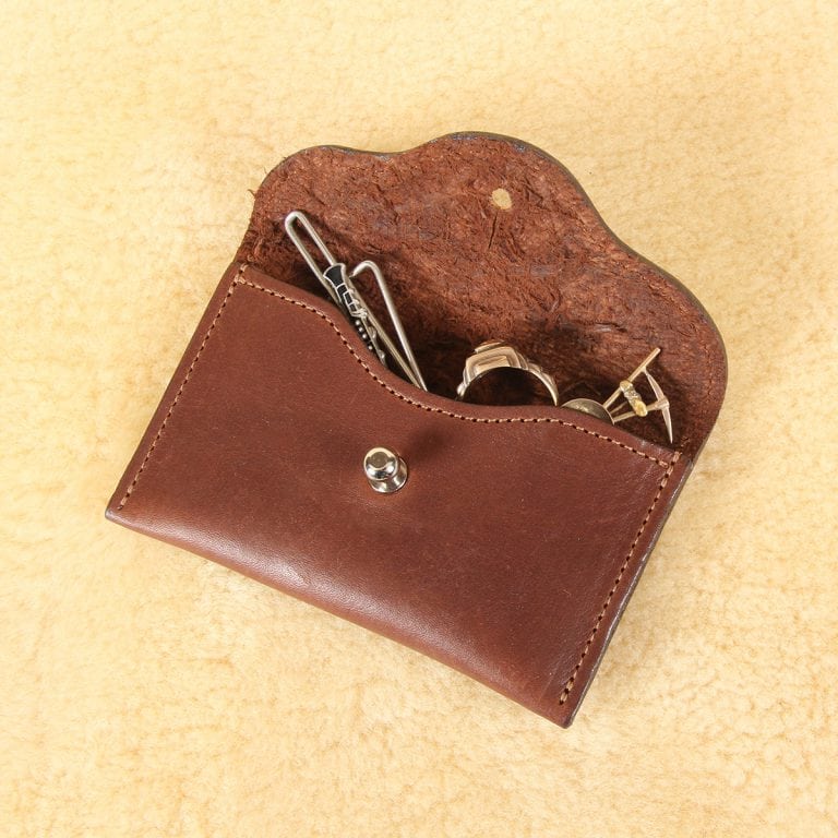 no15 vintage brown american leather pouch with contents spilling out