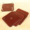 brown square leather coaster set in holder with letter personalization stamp
