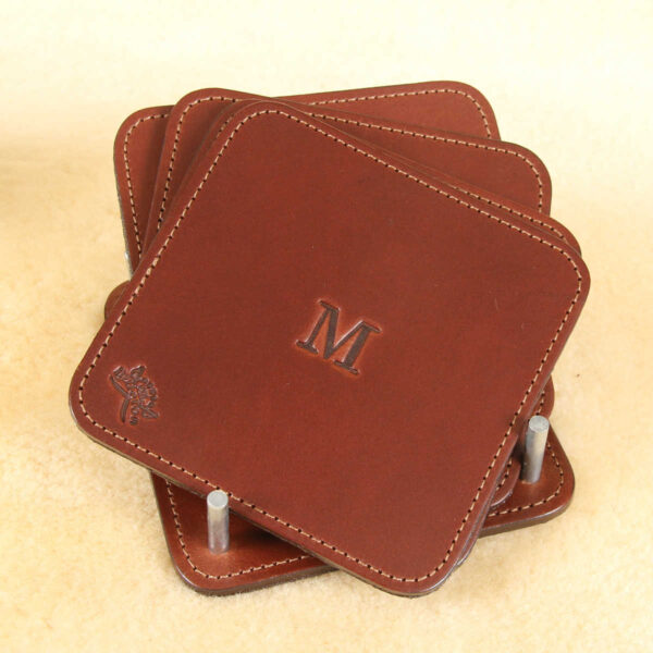 brown square leather coaster set in holder