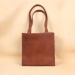 brown leather tote bag with strap
