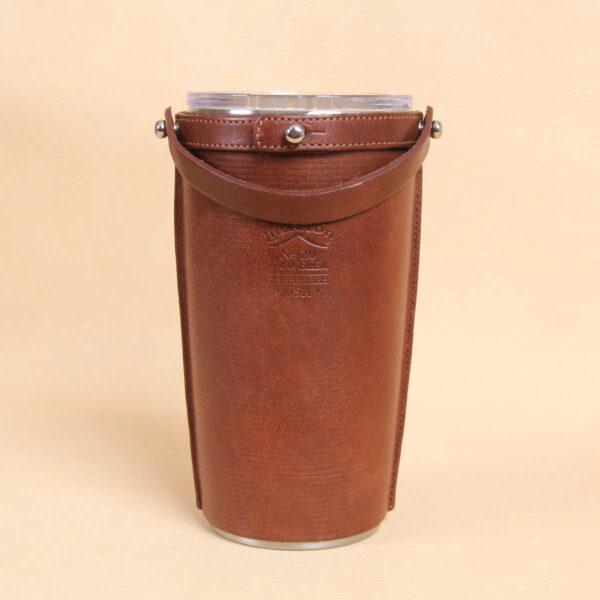 Leather tumbler sleeve for 20 ounce Yeti Rambler cup back side handle down.