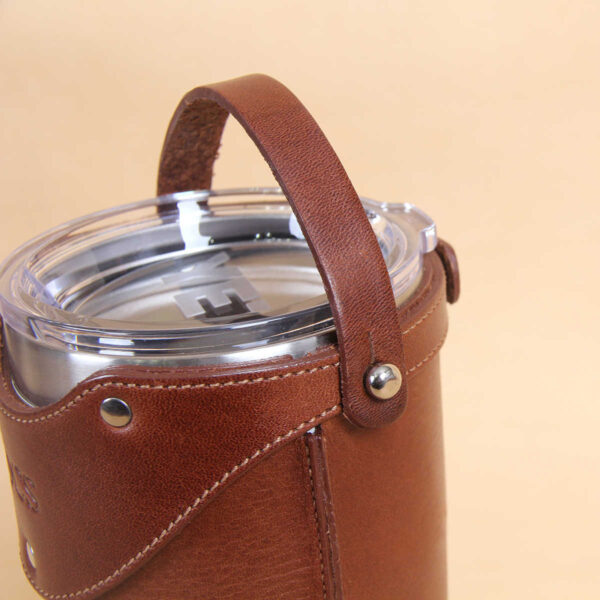 Leather tumbler sleeve for 20 ounce Yeti Rambler cup leather carrying handle.