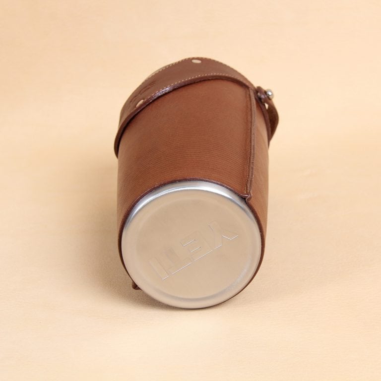 Leather tumbler sleeve for 20 ounce Yeti Rambler cup stainless cup bottom.