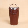 Leather tumbler sleeve for 20 ounce Yeti Rambler cup front with carry handle raised.