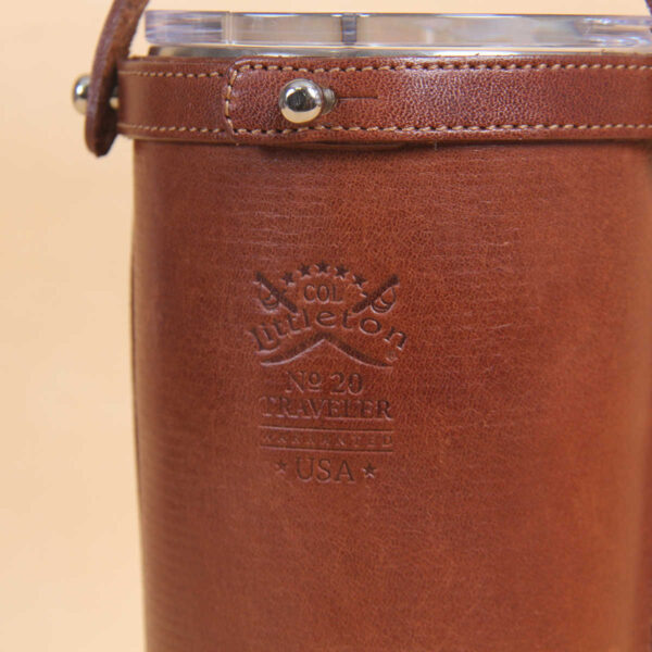 Leather tumbler sleeve for 20 ounce Yeti Rambler cup back close up of embossed Col Littleton logo.