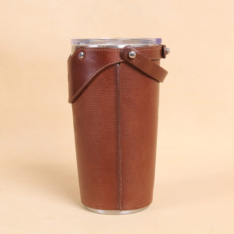 Leather tumbler sleeve for 20 ounce Yeti Rambler cup side edge stitching top to bottom.