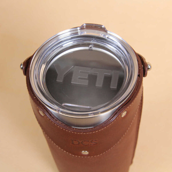 Leather tumbler sleeve for 20 ounce Yeti Rambler cup top plastic lid.